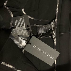 New with its labels.  beautiful black casual short